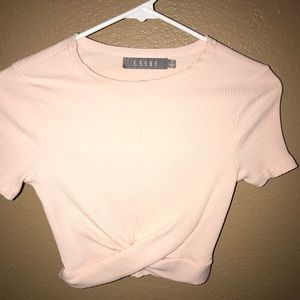 Cropped feint pink top.
